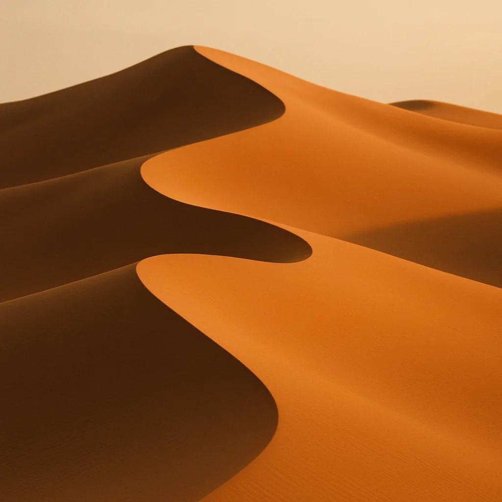 Jigsaw puzzle: Close-up of undulating golden sand dunes with contrasting light and shadow under a clear sky.
