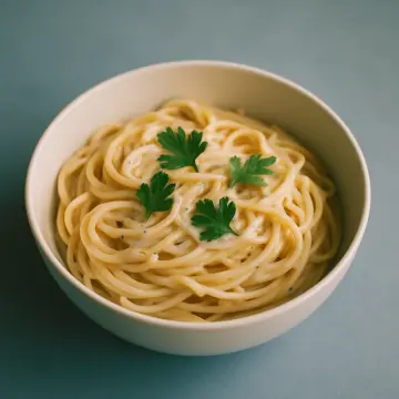 Jigsaw puzzle: A white bowl filled with creamy spaghetti, topped with fresh green parsley leaves.